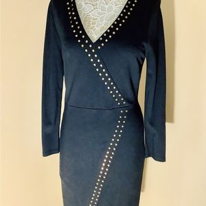 Carmen Marc Valvo‎ black dress with gold studs.